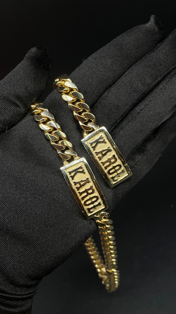 Custom gold nameplate bracelet with name charm at Tamayo's Jewelry